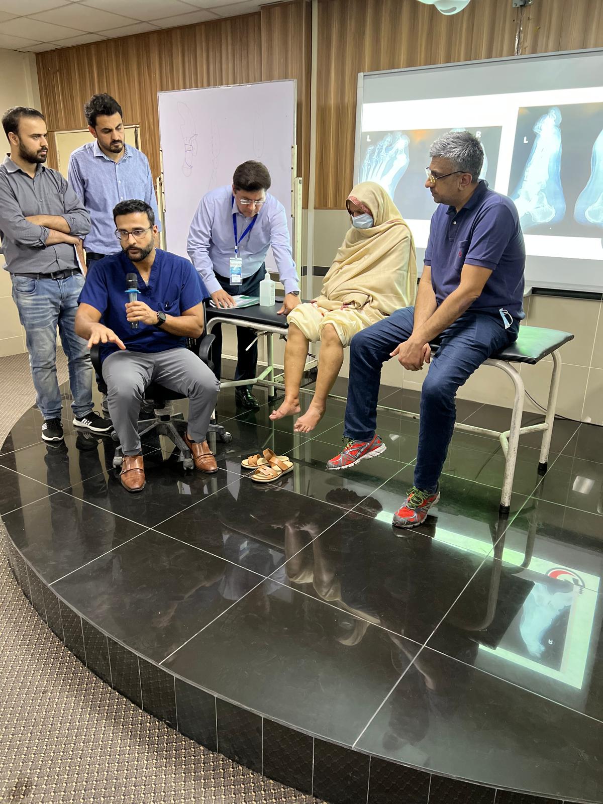 Dr. Noman A. Siddiqui during a clinical discussion and examination