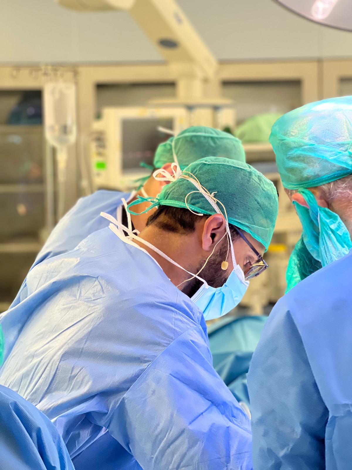 Dr. Noman A. Siddiqui wearing surgical attire in an operating room